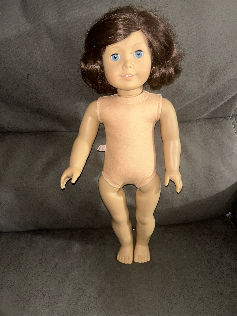 American Girl Brown-Haired Doll with Blue Eyes and Peach Bodysuit